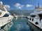 View of the city pier through moored yachts