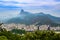 View of city Rio de Janeiro with Favelas in the hills with misty