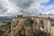 View of the city of Ronda at the top of the mountain, the Tajo de Ronda and the New Bridge, Puente Nuevo