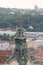 View of the city rooftops, church roof, tower, Å¼Å‚oty cross and park with trees in the background, the city of Lviv