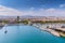 View on the city and sea port Barceloneta with yachts from high point