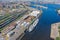 View of the city seaport, with a multitude of marine cranes, railway infrastructure, cargo ships