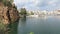 View at the Cityscape of Agios Nikolaos Crete Greece. Boats at small volcano lake voulismeni and its harbor. Traditional houses