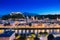 View of cityscape of Salzburg Cathedral, Fortress Hohensalzburg, and old castle in center of old town with river and road along