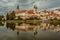 View of the cityscape of Telc and reflection in water