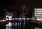 View of clarence dock in leeds at night with waterside buildings and lights reflected in the water