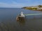 View of Clevedon Pier and Heritage Trust situated on shoreline in bright and sunny weather