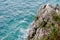 View from a cliff on the blue water of the sea in Montenegro. precipitous rocks, a place for text