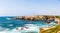 View of the cliffs and the lighthouse near praia pequena beach in Porto Covo