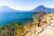 View from clifftop viewpoint across Lake Atitlan to volcanoes, Guatemala