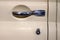 View on closed front door with handle and keyhole of the old Russian yellow retro vintage car of the executive class released in