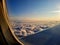 View of cloud from window of passing by aero plane