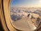 View of cloud from window of passing by aero plane