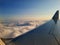 View of cloud from window of passing by aero plane