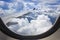 View of cloud with wing of airplane from window