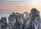 View of the clouds and the pine tree at the mountain peaks of Huangshan National park, China