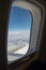 View of clouds, sky and airplane engine from aeroplane window