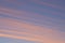 View of clouds streaked across the sky at sunset with copyspace. Soft pastel lines of colour in nature, blue sky in the