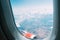 View of the cloudy sky, engine and wing of an airplane