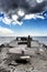 View of a cloudy sky over the historic USS Palo Alto ship site on the water