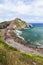 View from the coast on the rock in the ocean with a chapel Doniene Gaztelugatxeko