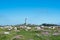 View from coastal fields with flowers towards the phare of Ile de Batz, France