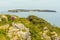 A view from the coastal path at Lydstep, Wales across the bay to Caldey island home to Cistercian Monks