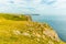 A view from the coastal path at Lydstep, Wales towards the Lydstep cavens and Caldey island home to Cistercian Monks