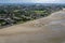 View of the coastal town with urban buildings in Sandymount, South Dublin, Ireland at low tide