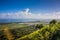 View of the coastline of the Atlantic Ocean on the island of Haiti. Green coastline turns into ocean