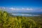 View of the coastline of the Atlantic Ocean on the island of Haiti. Green coastline turns into ocean