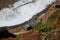 View of the coastline of CaniÃ§o, Madeira and a building with Welcome to Paradise written on the top