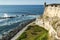 View of the coastline and outside wall of Fort El Morro in San Juan