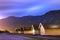 View of the coastline road Fv331 and the wooden houses at the port of Skjolden villageat night, Luster, Norway