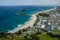 View of the coastline from the top of Mount Manganui with blue sky above, Tauranga, North Island, New Zealand