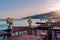 View of the coastline. Wooden tables and chairs on the waterfront by the sea. Massandra beach, Yalta, Crimea