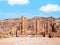 View with The Colonnaded Street and Temenos gate in the ancient city of Petra, Jordan. Street Facade cobble road in Petra