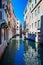View of colored venice canal with houses standing in water