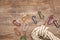 View of colorful carabiners and hiking rope on wooden table