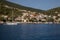 View of colorful houses and anchored sailing boats off the coast of the ITHACA island, KIONI Bay, Ionian Islands, Greece