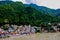 View of colorful houses at the foot of a lush mountain in Rishikesh