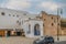 View of colorful plant pots, windows, on a typical house white wall, the Kasbah of the Udayas, in Rabat, Morocco.