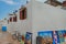 View of colorful plant pots, windows, on a typical house white wall, the Kasbah of the Udayas, in Rabat, Morocco.