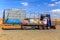 View of a colorful trailer burned in a desert