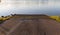 View of a concrete boat ramp leading into a lake in the early morning light