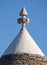 View of the conical dry stone roof of a traditional trullo house in Alberobello in Puglia Italy