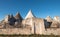 View of the conical dry stone roofs of a group of trulli houses outside Alberobello in Puglia Italy