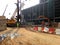 View of construction site during foundation work stage.