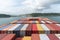 View on the containers loaded on deck of the large cargo ship.