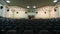 View of control booth from chairs in empty cinema hall